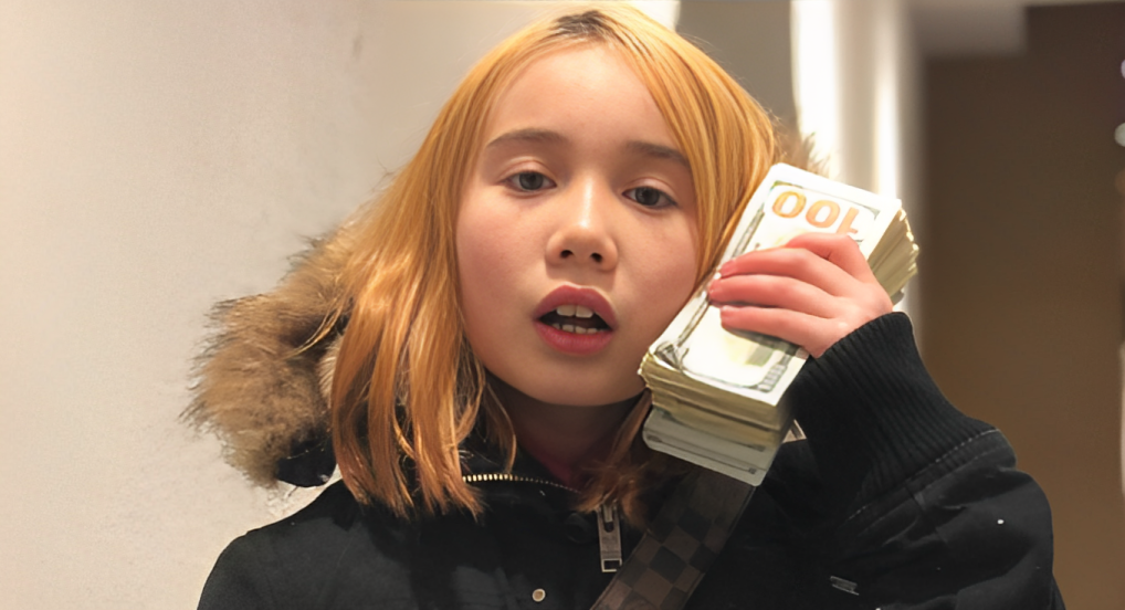 lil tay with a stack of money on her hands