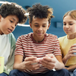 children looking at phone