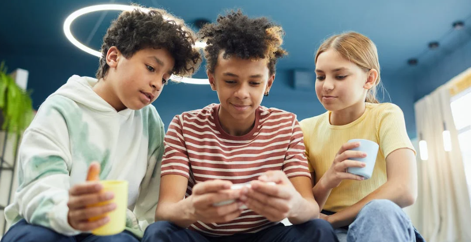 children looking at phone