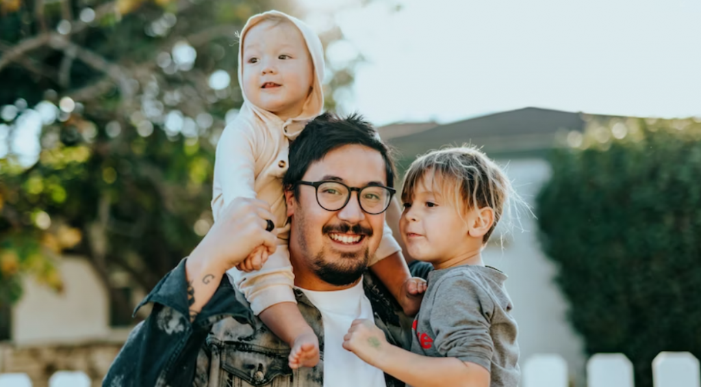 man carrying children