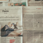 person holding newspaper