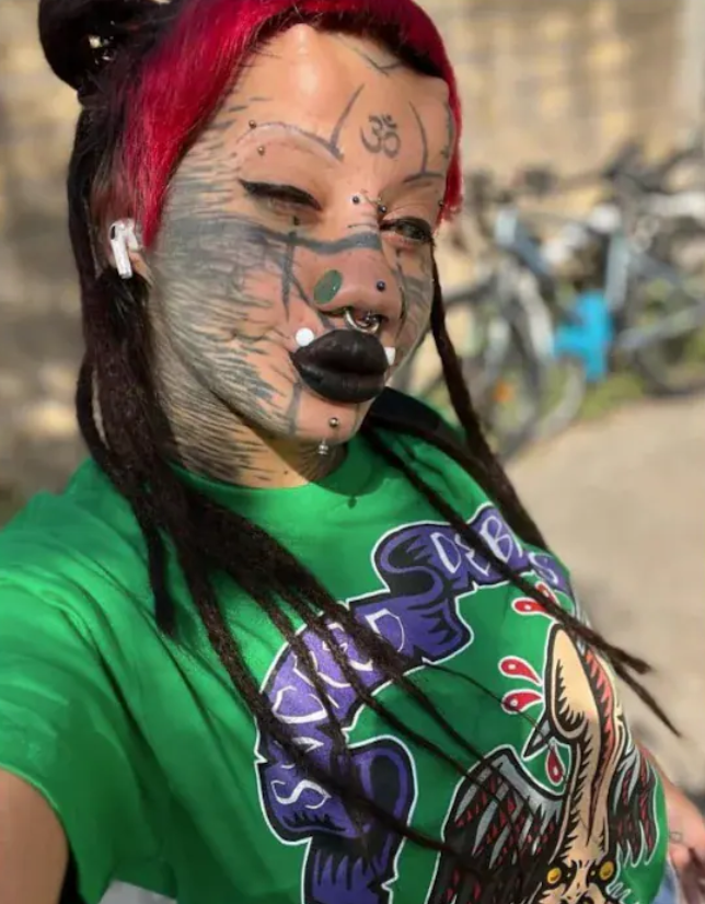 woman turns into Human Catwoman through body modifications