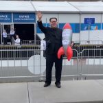 Kim Jong Un Impersonator Howard X in a YouTube video discussing his impact on global politics through satire.