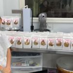 League City girl flood relief cookies displayed with pink bows and handmade tags.